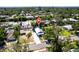 Aerial view of a home in a residential neighborhood surrounded by trees at 717 84Th Nw St, Bradenton, FL 34209