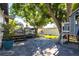 Charming backyard featuring a deck, swing, patio and play structure at 717 84Th Nw St, Bradenton, FL 34209