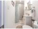 Bathroom with a patterned shower curtain and tile walls with a vanity at 717 84Th Nw St, Bradenton, FL 34209