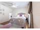 Bright bedroom with hardwood floors, a ceiling fan, a sitting area, and bright window views at 717 84Th Nw St, Bradenton, FL 34209