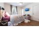Cozy bedroom with hardwood floors, a ceiling fan, a comfortable sitting area and a bright window at 717 84Th Nw St, Bradenton, FL 34209