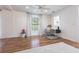 Spacious room featuring hardwood floors, ample natural light, and a built-in desk area perfect for a home office at 717 84Th Nw St, Bradenton, FL 34209