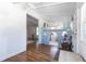 Hardwood floors meet a castle-themed playroom and an ornate storage bench in the home's entry area at 717 84Th Nw St, Bradenton, FL 34209