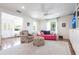 Bright and open living room with hardwood floors, a comfortable seating area, and large windows with natural light at 717 84Th Nw St, Bradenton, FL 34209