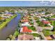 Waterfront community featuring single-Gathering homes with mature landscaping and waterway access at 74 Windsor Dr, Englewood, FL 34223