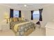 Cozy bedroom featuring ceiling fan, and neutral walls at 74 Windsor Dr, Englewood, FL 34223
