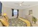 Comfortable bedroom featuring a ceiling fan, neutral walls, and a matching dresser at 74 Windsor Dr, Englewood, FL 34223