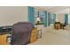 Bedroom with a computer desk, chair, and a closet with mirrored doors at 74 Windsor Dr, Englewood, FL 34223