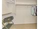 Walk-in closet with hanging clothes, shelves and open space at 74 Windsor Dr, Englewood, FL 34223