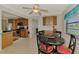 Bright dining area with adjacent kitchen and dining table offering a seamless transition for entertaining and everyday living at 74 Windsor Dr, Englewood, FL 34223