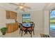 Cozy dining area with natural light, complemented by neutral tones, creating a tranquil space for enjoying meals at 74 Windsor Dr, Englewood, FL 34223