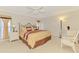 Comfortable bedroom with neutral walls, ceiling fan, and traditional furnishings at 74 Windsor Dr, Englewood, FL 34223