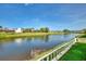 Relaxing water views from manicured backyard create a picturesque setting at 74 Windsor Dr, Englewood, FL 34223