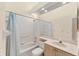 Bathroom showcasing a shower-tub combo, vanity, and a large mirror at 7617 Whitebridge Gln, University Park, FL 34201