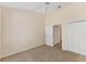 Neutral bedroom featuring two closets and an adjoining room entrance at 7617 Whitebridge Gln, University Park, FL 34201