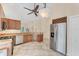 Kitchen area featuring stainless steel appliances, granite countertops and a wine rack at 7617 Whitebridge Gln, University Park, FL 34201