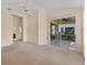Spacious main bedroom with neutral carpeting and sliding door to a patio at 7617 Whitebridge Gln, University Park, FL 34201
