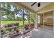 Relaxing screened-in patio offering serene views of the golf course, an ideal space for outdoor living at 7617 Whitebridge Gln, University Park, FL 34201