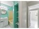 A look inside the bathroom with built-in shelves, and tile flooring at 8075 48Th N Ave, St Petersburg, FL 33709