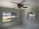 Bedroom with tile floors, natural light, and a ceiling fan at 8075 48Th N Ave, St Petersburg, FL 33709