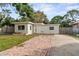 Charming single-story home with a brick driveway and a well-manicured lawn at 8075 48Th N Ave, St Petersburg, FL 33709