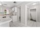 Well-lit kitchen includes appliances, tile flooring and leads to a pantry area at 8075 48Th N Ave, St Petersburg, FL 33709