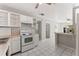 Cozy kitchen with white appliances, ample counter space, open to dining area at 8075 48Th N Ave, St Petersburg, FL 33709