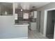 Bright kitchen with white appliances and plenty of counter space, open to the dining area at 8075 48Th N Ave, St Petersburg, FL 33709