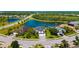 An aerial view of a home in a community with ponds and lush landscaping on an expansive lot at 826 Honeyflower Loop, Bradenton, FL 34212