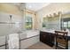 Bathroom featuring a vanity with a granite countertop, a tub, and a shower at 826 Honeyflower Loop, Bradenton, FL 34212