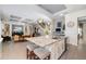 Open kitchen with large island, bar stool seating, and seamlessly connecting to the living area at 826 Honeyflower Loop, Bradenton, FL 34212