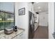 Bright kitchen featuring granite countertops, stainless steel appliances, and tile flooring at 826 Honeyflower Loop, Bradenton, FL 34212