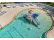 Fun community splash pad with interactive features including a mushroom fountain and slide at 826 Honeyflower Loop, Bradenton, FL 34212