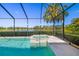 The luxurious pool has an attached jacuzzi spa and overlooks a scenic lake in a screened-in enclosure at 826 Honeyflower Loop, Bradenton, FL 34212