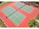 Aerial close up of recently resurfaced community tennis courts at 826 Honeyflower Loop, Bradenton, FL 34212