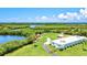 Expansive aerial view showcasing the idyllic waterfront property and recreational area for boating and kayaking at 830 Trento Dr, Venice, FL 34285