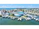 Expansive aerial view of waterfront yacht club, docks and boats with ocean view and charming community at 830 Trento Dr, Venice, FL 34285