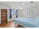 Well-lit bedroom with wood floors, ample closet space, and natural light at 830 Trento Dr, Venice, FL 34285