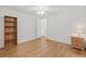 Bright bedroom features wood floors, ceiling fan, and closet at 830 Trento Dr, Venice, FL 34285
