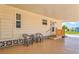 Comfortable carport seating with access ramp and covered parking at 830 Trento Dr, Venice, FL 34285