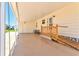 Covered parking area featuring an accessible ramp and seating at 830 Trento Dr, Venice, FL 34285