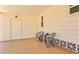 Carport featuring seating area and entry door at 830 Trento Dr, Venice, FL 34285