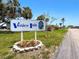 Venice Isle sign with inviting landscaping and well-kept grounds at 830 Trento Dr, Venice, FL 34285