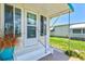 Charming entrance with decorated door and lush front landscaping at 830 Trento Dr, Venice, FL 34285