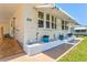 Beautiful home with awning-covered windows and lovely front garden at 830 Trento Dr, Venice, FL 34285