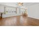 Inviting open-concept living and dining area featuring wood floors and bright natural light at 830 Trento Dr, Venice, FL 34285