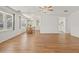 Inviting open-concept living and dining area featuring wood floors and bright natural light at 830 Trento Dr, Venice, FL 34285