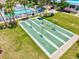 Aerial view of shuffleboard courts, providing a recreational activity within a well-maintained community setting at 830 Trento Dr, Venice, FL 34285