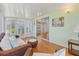 Relaxing sunroom featuring sliding glass doors, ample seating, and plenty of light at 830 Trento Dr, Venice, FL 34285