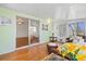 Cozy sunroom with comfortable furniture and views to sliding door and multiple windows at 830 Trento Dr, Venice, FL 34285